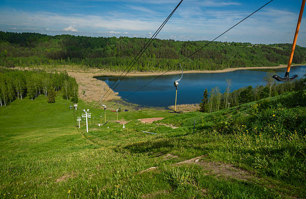 funicular at the sports base at the backdrop of green hills and lakes