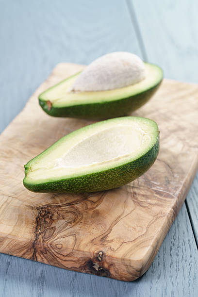 istock ripe green avocado on blue wood table 538587092