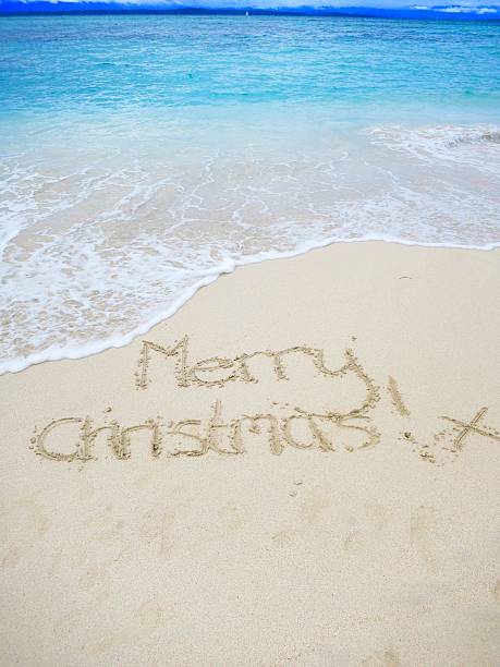 istock Merry Christmas written in sand on tropical beach 538592310