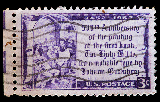 UNITED STATES OF AMERICA - CIRCA 1952: A used postage stamp printed in United States shows a reproduction from the first printed Bible in 1452, first major book printed using mass-produced movable type by Johannes Gutenberg, circa 1952