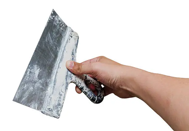 palette-knife in hand isolated on a white background