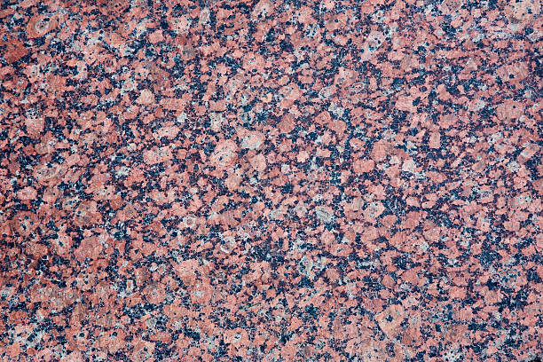 istock Stone Background of mottled red granite igneous rock 538595440
