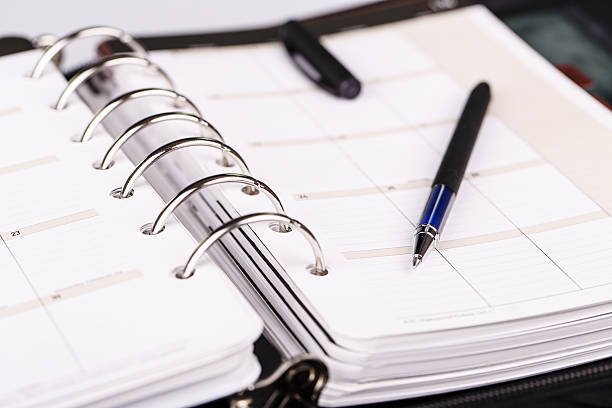 istock Personal organizer or planner with pen on white background 538595558