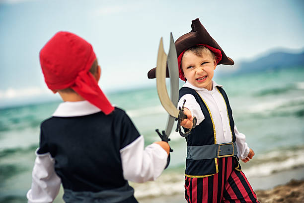 istock Little pirates fighting on a beach 538596468