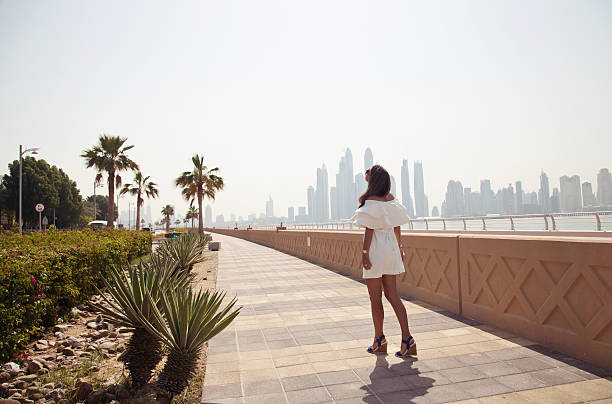 Dubai travel tourist woman on vacation in the Palm Jumeirah stock photo