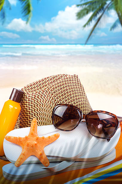 istock Summer background with starfish and accessories on sand beach 538597684
