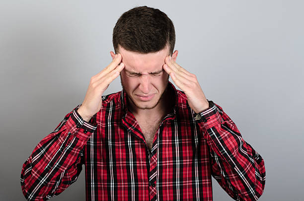 istock Portrait Of Man with headache On Gray Background 538598064