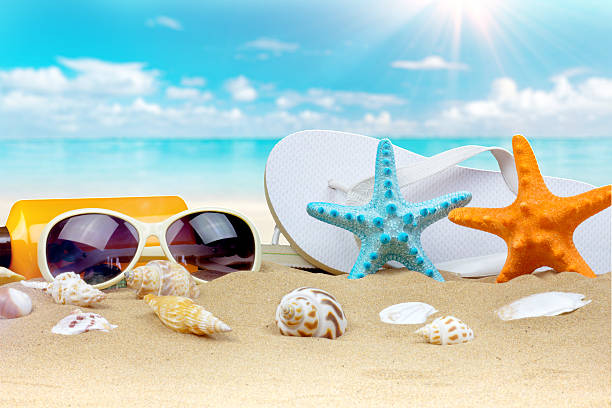 istock Summer background with starfish and accessories on sand beach 538598526