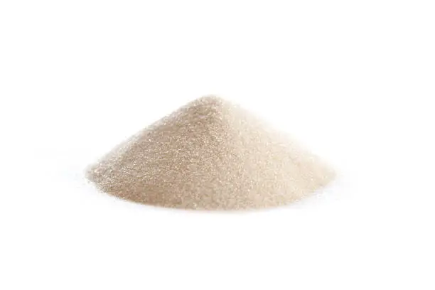 Gelatin powder on white, also spelled gelatine, used as a gelling agent for food, pharmaceuticals, photography and cosmetics.