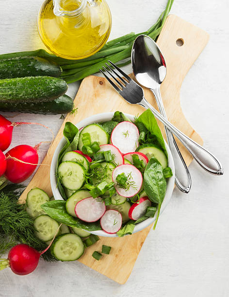 istock Salad with spinach, cucumber, radish in a bowl 538599156