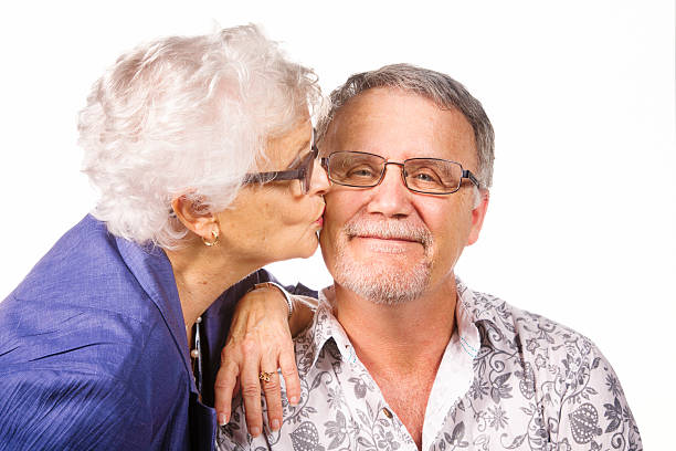 istock Satisfied senior man smiles as he is kissed 538599534