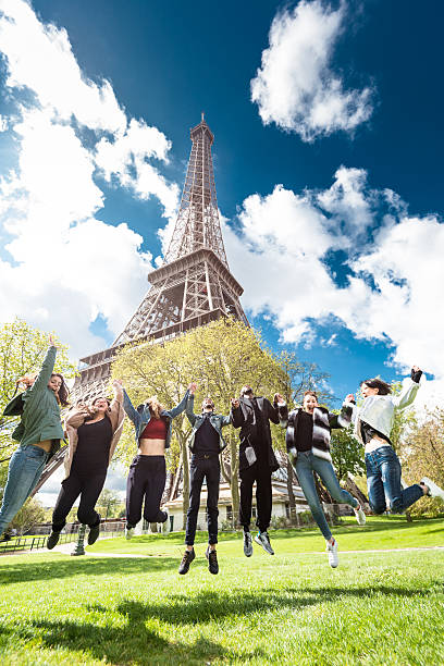 istock Group of people jumping on the park under tour eiffel 538600884