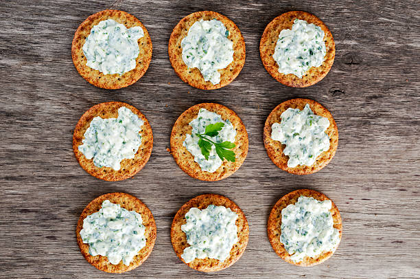 istock Bisquit cracker appetizers with cottage chees and parsley topping 538602578