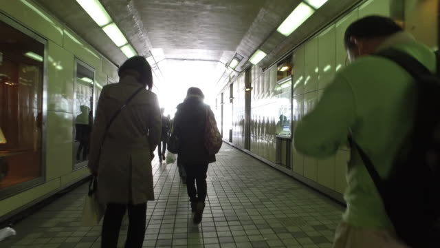 People walking in the tunnel