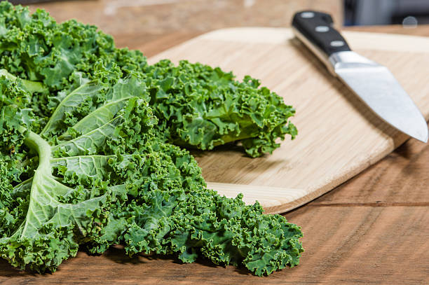 istock Green curly kale and knife 538615207