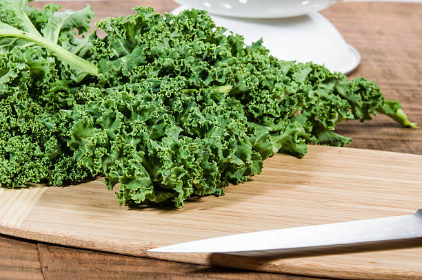 istock Green curly kale and knife 538615219