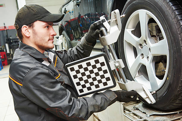 car wheel alignment service work stock photo