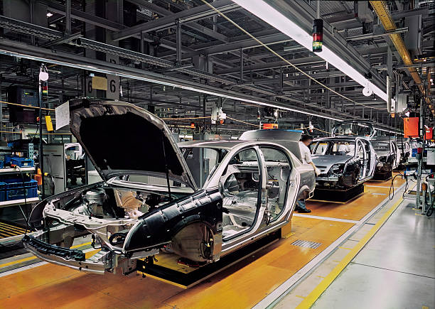 car production line car production line with unfinished cars in a row automobile industry photos stock pictures, royalty-free photos & images