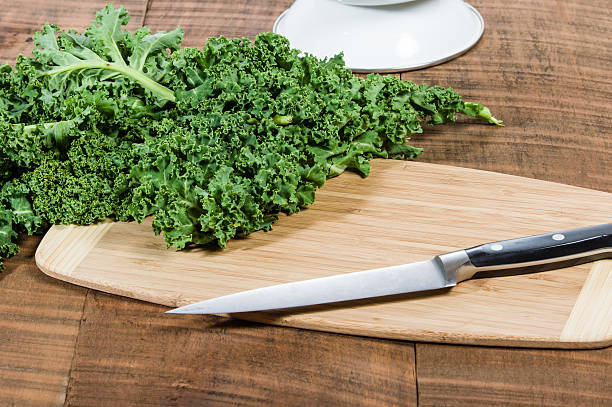 istock Green curly kale and knife 538618093