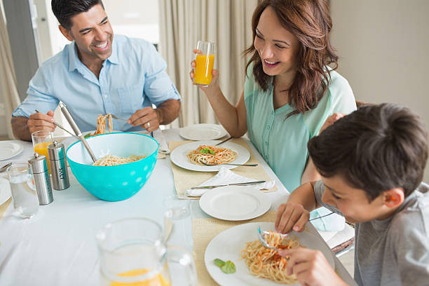 istock High angle view of family at dining table 538621815