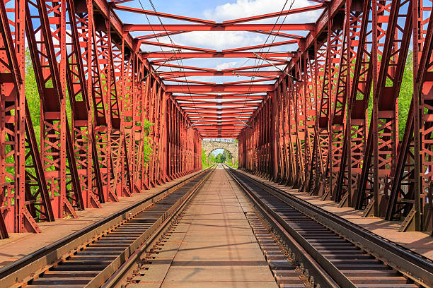 istock Railroad on a red bridge in summer day 538642142