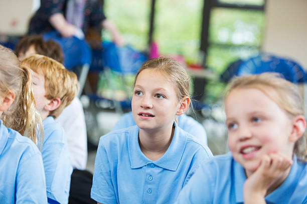 istock Young School Girl Paying Attention in Class 538644347