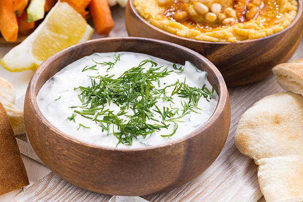 istock yoghurt sauce and hummus, vegetables, pita, close-up 538644499