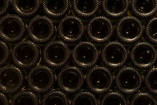 Champagne bottle stacked on top of each other in wine cellar, Napa Valley, California, USA