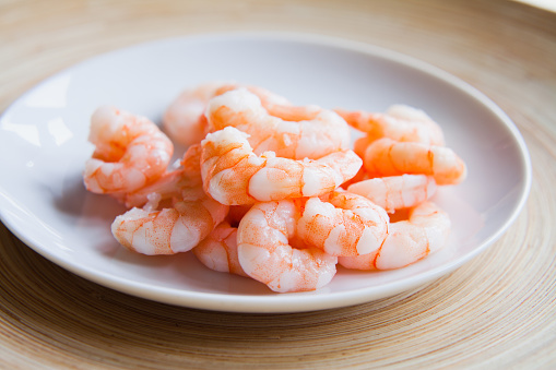 Shrimp KIng  Prawn on white dish on wooden background.