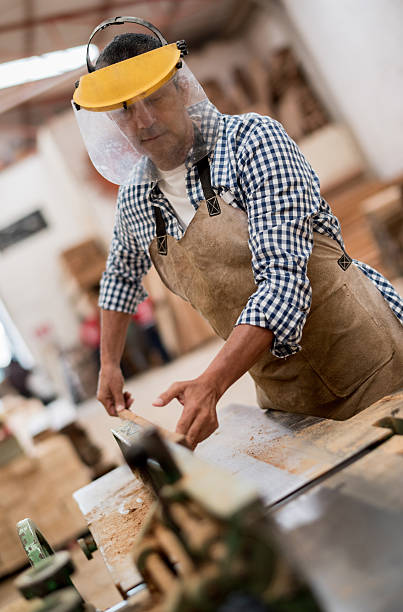istock Man cutting wood at the carpentry 538645093