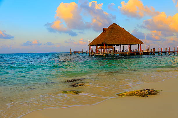 istock Gazebo palapa, beach, dramatic sunset - Cancun, caribbean tropical paradise 538645100