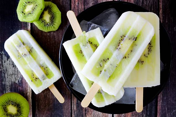 istock Kiwi vanilla yogurt popsicles on dark rustic wood 538645278