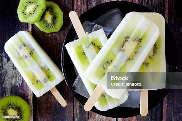 Kiwi Vanilla Yogurt Popsicles On Dark Rustic Wood Stock Photo - Download Image Now - Flavored Ice, Homemade, Above