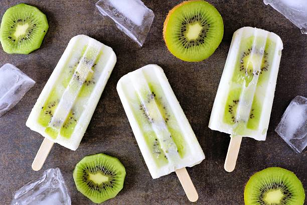 istock Kiwi vanilla yogurt popsicles on dark stone 538645326