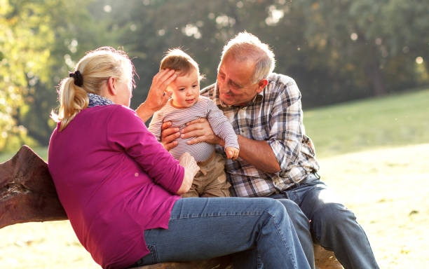 istock Grandparents and grandson in park 538646083