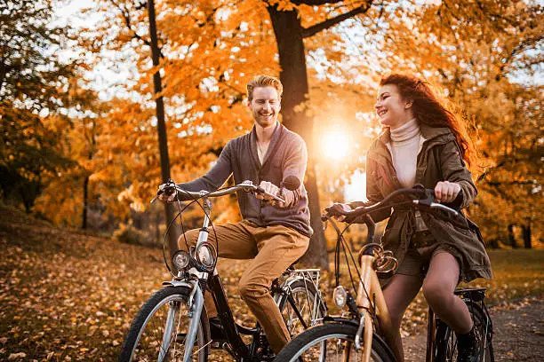 Photo of Riding bikes in autumn day.