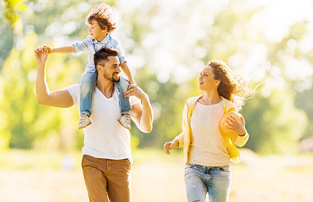 istock Parents having fun with their son outdoors. 538646455