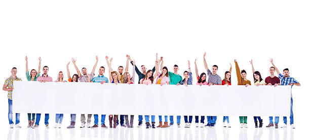 istock Cheerful young people holding placard. 538646501
