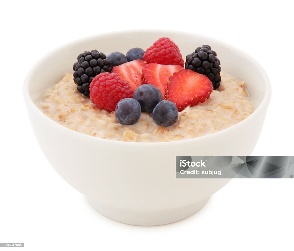 Oatmeal and Berries Bowl Oatmeal and fresh strawberry, blueberries, raspberries and blackberries in a Bowl isolated on white (excluding the shadow) Oatmeal Stock Photo