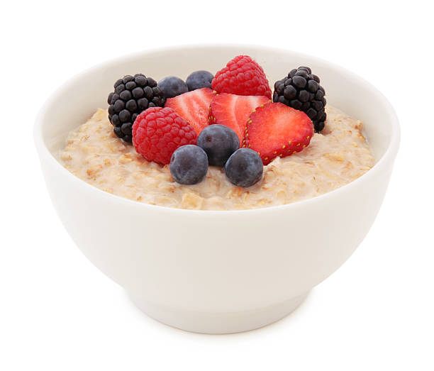 Oatmeal and Berries Bowl Oatmeal and fresh strawberry, blueberries, raspberries and blackberries in a Bowl isolated on white (excluding the shadow) porridge stock pictures, royalty-free photos & images