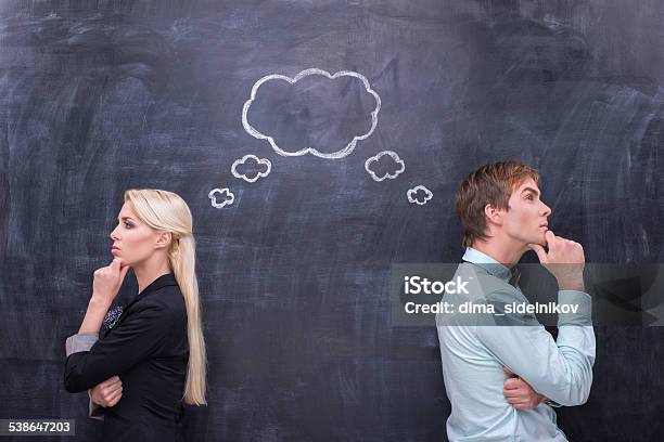 Bussinesman And Bussineswoman Searching The Solution Together Stock Photo - Download Image Now