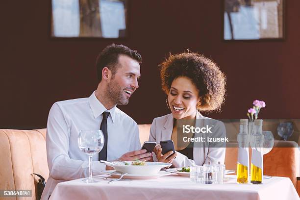 Businessman And Businesswoman On Lunch Stock Photo - Download Image Now - Couple - Relationship, Dinner, Corporate Business