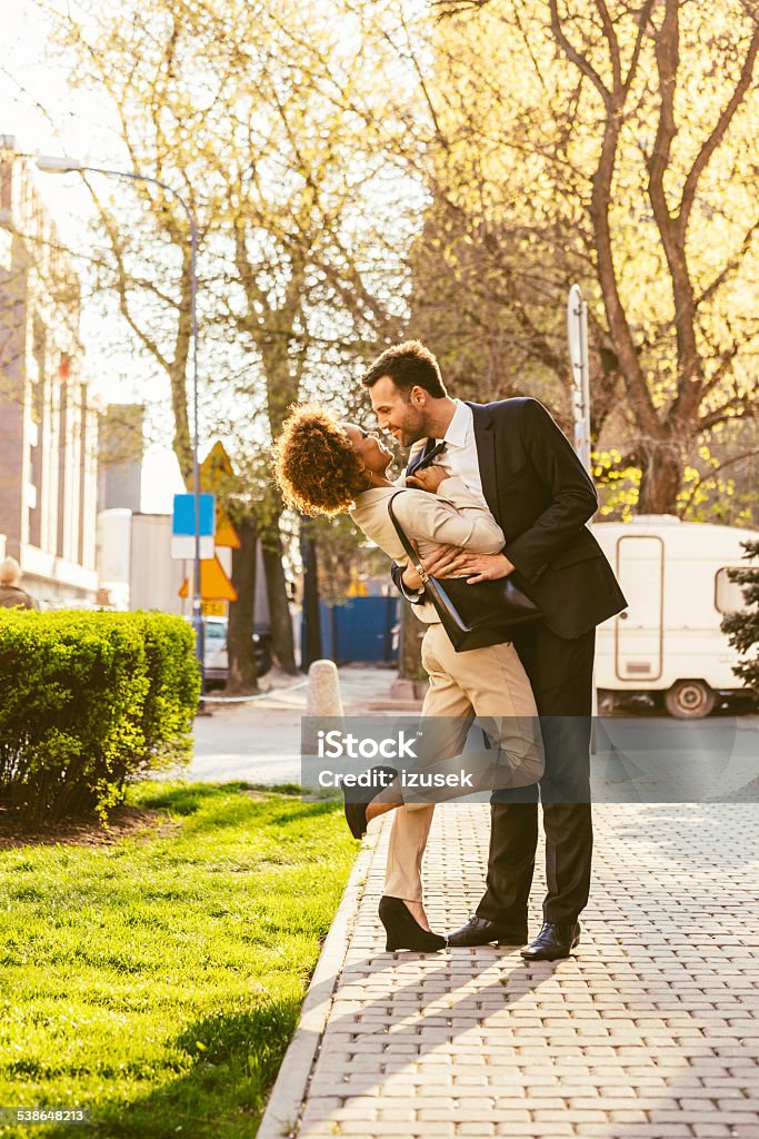 Happy couple embracing outdoor Full lenght portrait of happy elegance adult couple embracing outdoor. 2015 Stock Photo