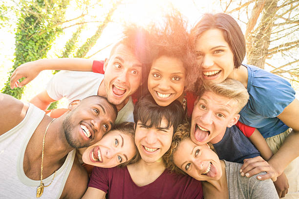 istock Happy best friends taking selfie outdoor with back lighting 538650362