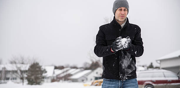 istock Mature man have fun outdoor under the snowfall 538650406