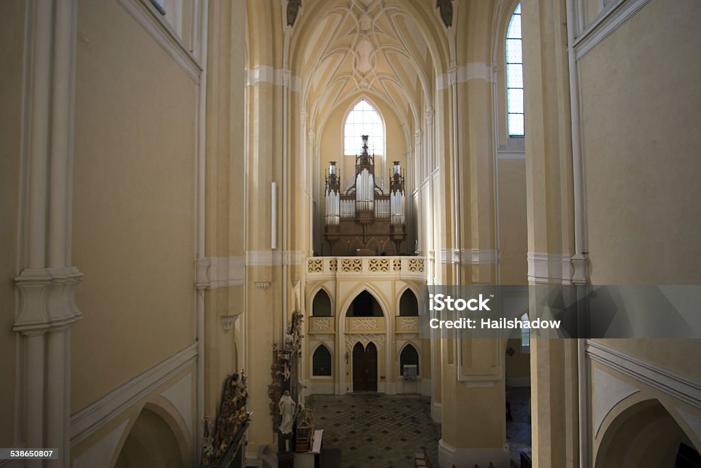 Sedlec Cathedral Interior hall The Church of the Assumption of Our Lady and Saint John the Baptist is a Gothic and Baroque Gothic church north-east of Kutná Hora in the Czech Republic and is listed in the UNESCO World Heritage List together with the Chapel of All Saints and its ossuary and other monuments in Kutná Hora. It is one of the most important Czech Gothic buildings built in the time of the very last Přemyslids and also a very important and one of the oldest examples of the Baroque Gothic style (connected with the Czech Baroque architect Jan Blažej Santini-Aichel). 2015 Stock Photo