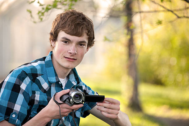 istock Teenager with Video Camera Outdoors 538651749