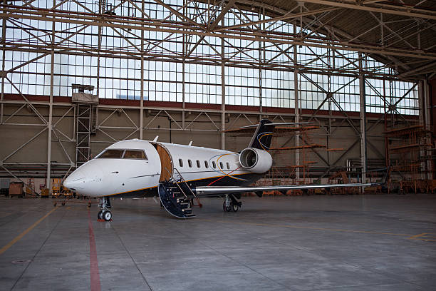 istock Business jet airplane stays in hangar. 538651955