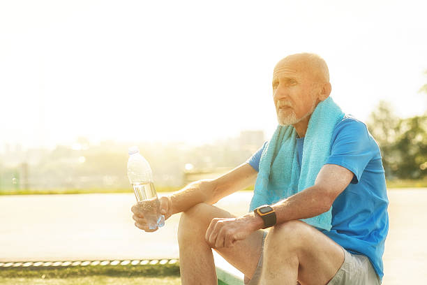 istock Senior man, holding water bottle 538652244