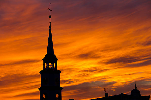 Silhouette of church of St Mathieu in Laguiole at sunset. Laguiole, Aubrac, cevennes, France.